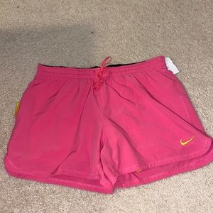 Pink and yellow livestrong Nike shorts medium